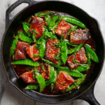 Testosterone Booster Recipe garlic ginger tuna stir-fry with snow peas in cast iron skillet