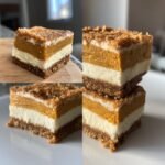 Close-up of layered Pumpkin Cheesecake Bars with a crumb topping on a white plate.