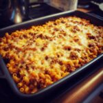 Baked Creamy Ground Turkey Pasta with Melty Cheese in a casserole dish, ready to serve.