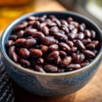 Close-up of a bowl of Quick and Easy Seasoned Vegan Black Beans, showing their texture and seasoning.