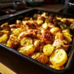Close up of Sheet Pan Lemon Balsamic Chicken Potatoes on a baking sheet, ready to serve.
