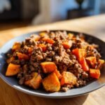 A plate of Sweet Potato Beef Bowl Recipe with diced sweet potatoes and seasoned ground beef.