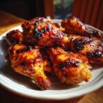 Close-up of BBQ chicken wings. Consider pairing with High-Protein Weight Loss Soup for Healthy Eating.