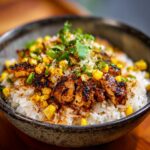 A flavorful chicken rice bowl with grilled chicken, corn, and fresh herbs. Ready in 30 minutes.