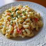 Close-up of a plate of Classic Simple Macaroni Salad Recipe with elbow macaroni, creamy dressing, and chopped vegetables.