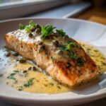 A perfectly cooked salmon fillet with creamy lemon sauce, capers, and parsley. Creamy Lemon Salmon Piccata.