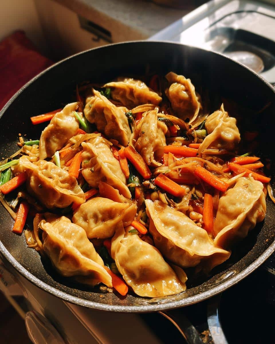 Easy Potsticker Stir Fry Recipe: Delicious in 20 Minutes 8 Pan of Easy Potsticker Stir Fry Recipe with potstickers, carrots, and green onions.