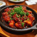 Delicious Korean chicken glazed in a red sauce, garnished with parsley and sesame seeds. Creamy Vegan Pot Pie.