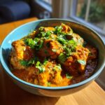 A bowl of Quick & Easy Homemade Butter Chicken, garnished with fresh cilantro, ready to serve.