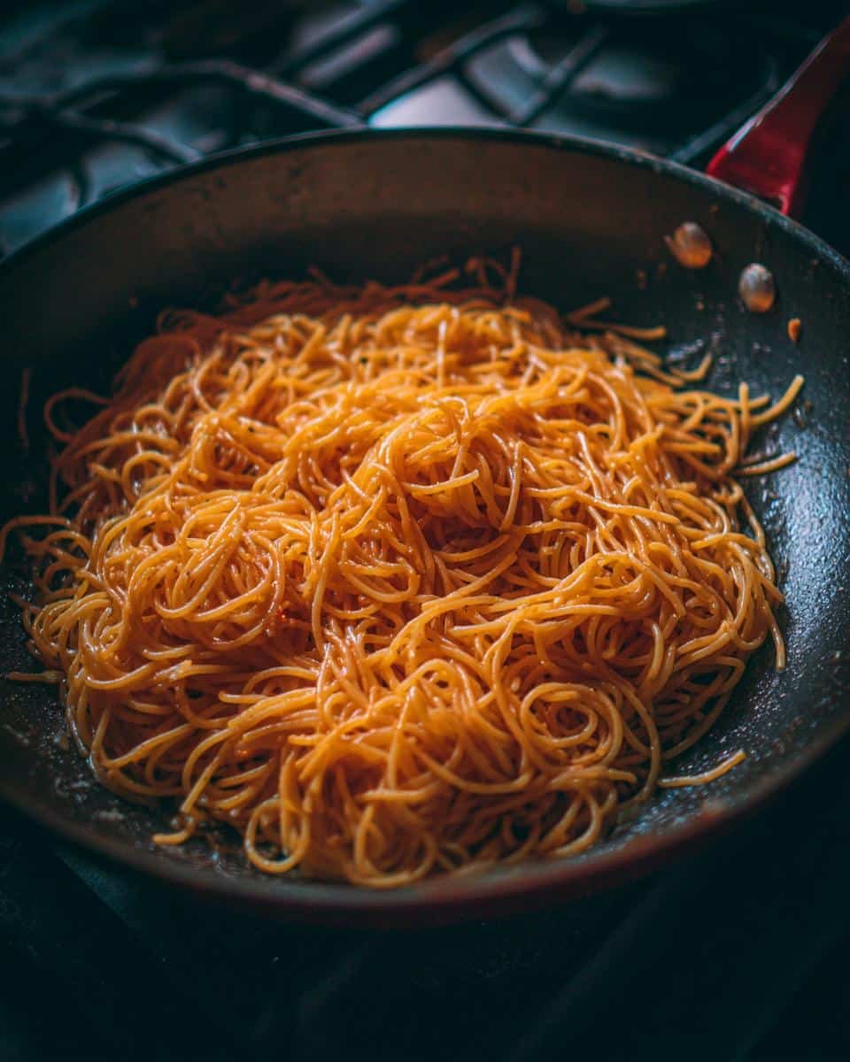 Summer Garden Pasta: 5 Glorious Veggie Minutes 6 A pan filled with Summer Garden Pasta, ready to be served. The pasta is coated in a light sauce.