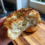 Close-up of a cottage cheese protein bagel air fryer recipe, showing the inside texture.