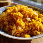 Close-up of a plate of easy Mexican rice without tomato sauce, featuring rice and onions.