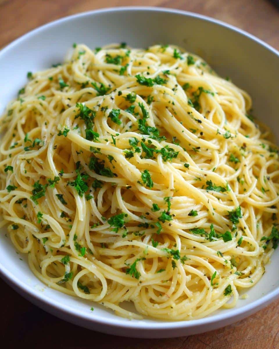 Zingy Lemon Capellini Salad Recipe in Under 20 Minutes 9 Bowl of Lemon Capellini Salad with fresh parsley, ready to enjoy. A quick and easy pasta dish.