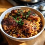 Bowl of chicken and rice with black beans and herbs. Not blueberry oatmeal cottage cheese protein pancakes.
